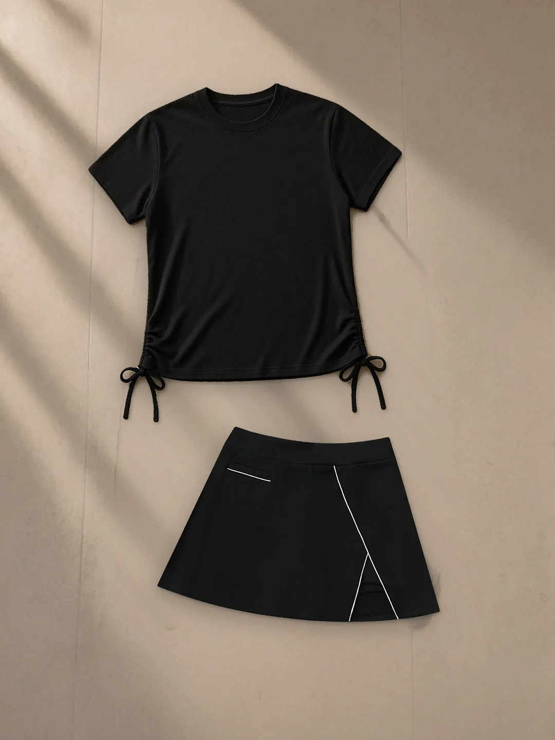 High-Waist Pocketed A-Line Skirt — Black, a Marcel Afters skirt, photographed flat on a warm studio backdrop.