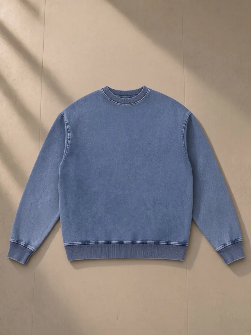Snow Wash Oversized Crewneck Sweatshirt — Black & Light Blue, a Marcel Afters sweatshirt, photographed flat on a warm studio backdrop.