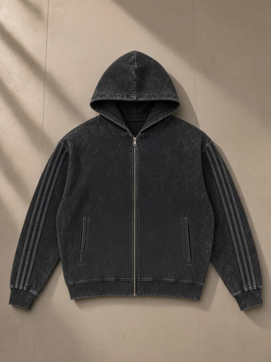 Snow Washed Tape Raw Edge Zip Hoodie — Black & Dark Gray, a Marcel Afters zip hoodie, photographed flat on a warm studio backdrop.