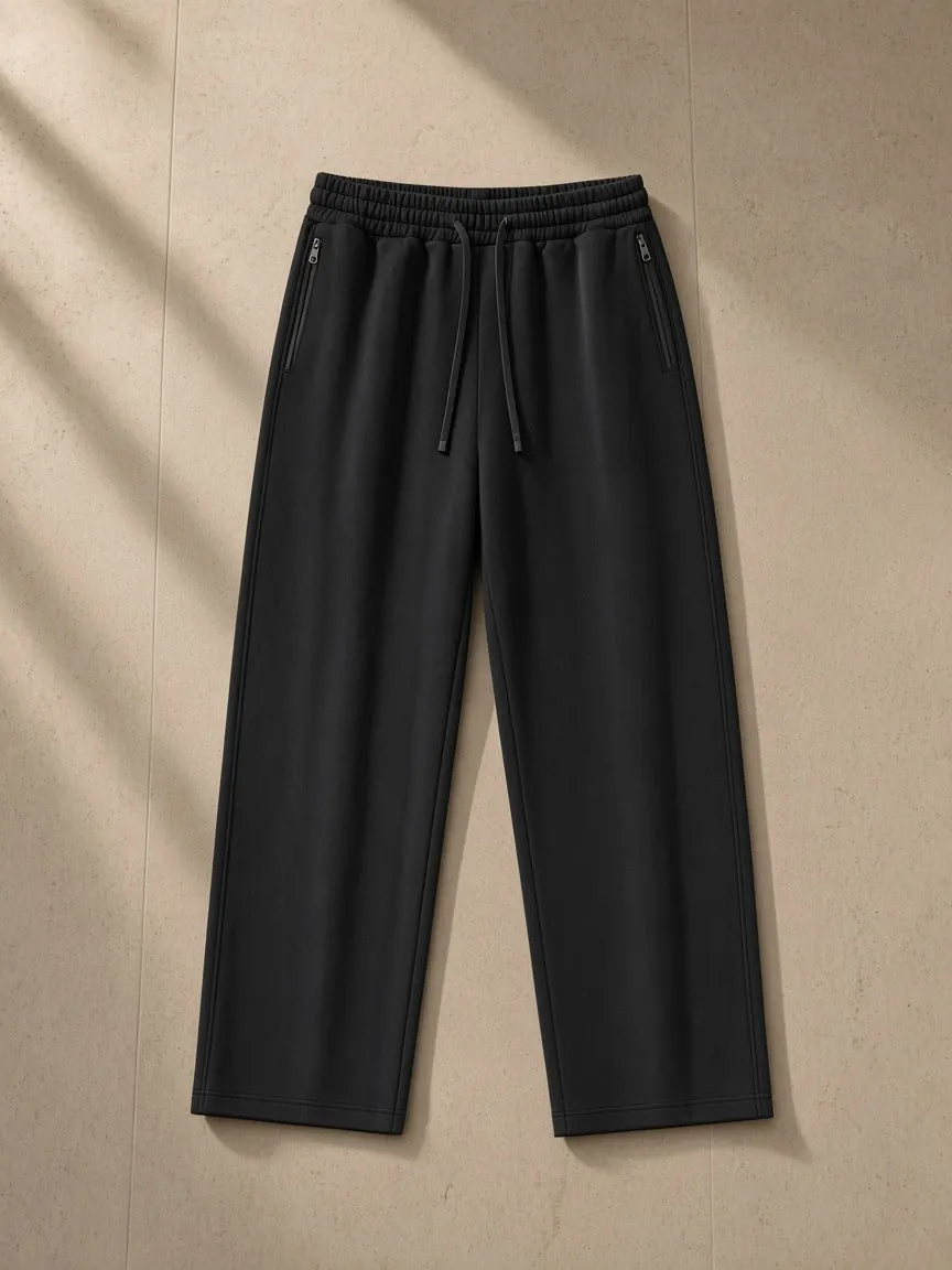 Lightweight Tapered Track Pants, a Marcel Afters track pants, photographed flat on a warm studio backdrop.