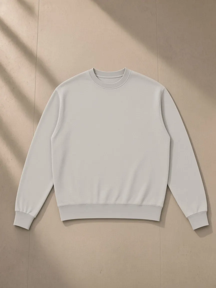 Vintage Wash Crewneck Sweatshirt — Light Gray, a Marcel Afters sweatshirt, photographed flat on a warm studio backdrop.