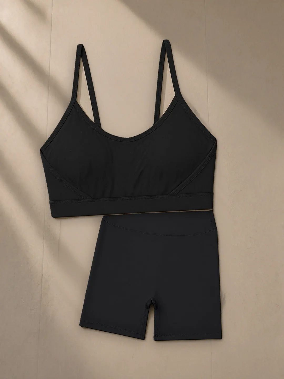 Women’s Tight Yoga Sports Bra, a Marcel Afters sports bra, photographed flat on a warm studio backdrop.